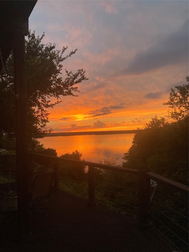 nature at dusk featuring a water view