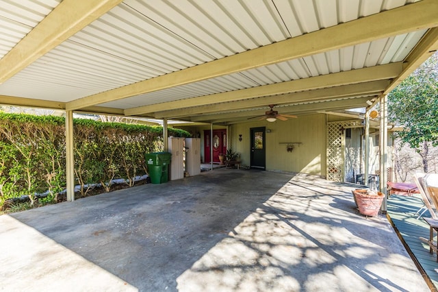 view of patio / terrace featuring an attached carport and a ceiling fan