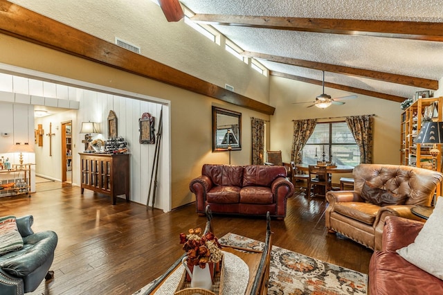 living area with a textured ceiling, lofted ceiling with beams, wood-type flooring, and visible vents