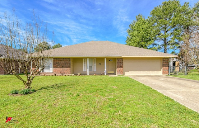 single story home with a front yard and a garage