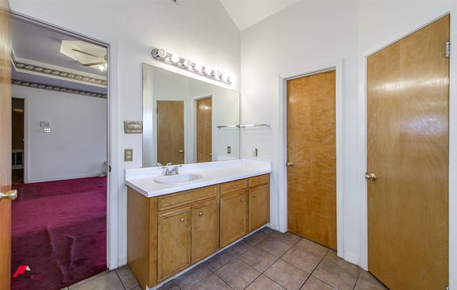 bathroom featuring oversized vanity, ceiling fan, and tile floors