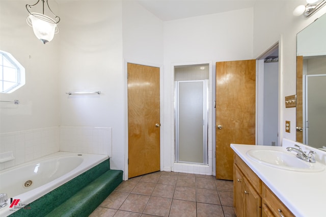 bathroom featuring tile flooring, separate shower and tub, and large vanity