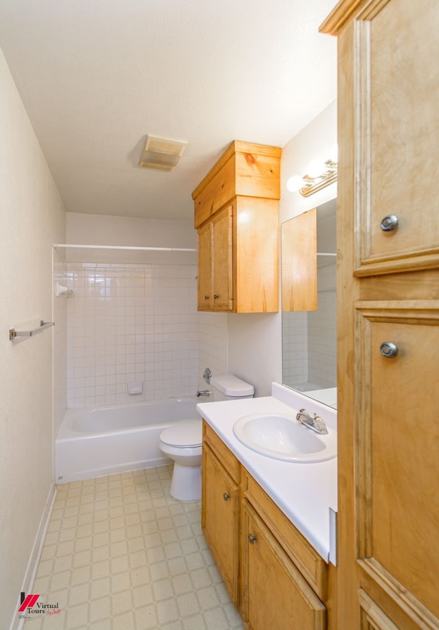 full bath featuring tile patterned floors, toilet, shower / bath combination, baseboards, and vanity