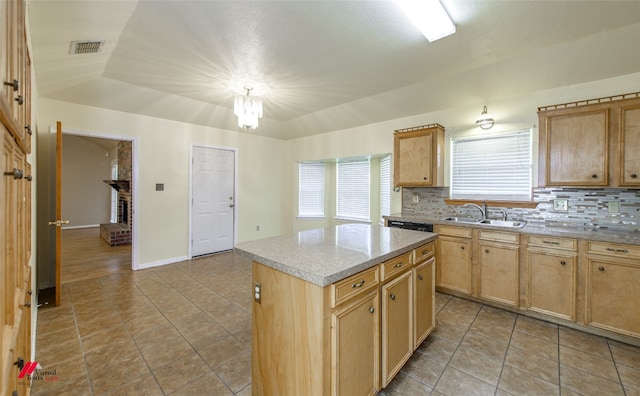 kitchen with backsplash, sink, light tile floors, and a kitchen island