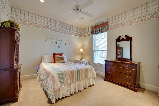 carpeted bedroom with ceiling fan and ornamental molding