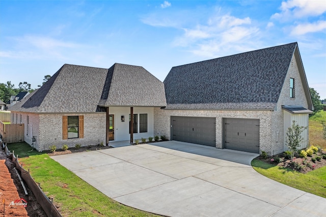 french country inspired facade with a garage