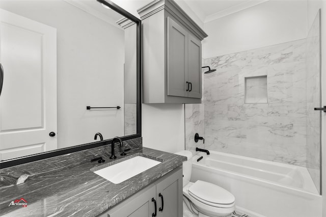 full bathroom featuring crown molding, vanity, toilet, and tiled shower / bath combo