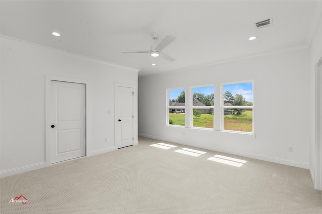 interior space featuring ceiling fan, carpet flooring, and ornamental molding