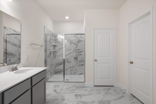 bathroom featuring vanity and a shower with shower door