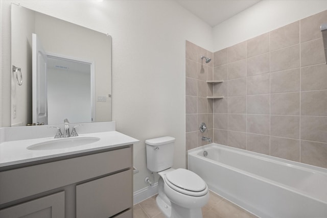 full bathroom featuring tile patterned flooring, vanity, tiled shower / bath combo, and toilet