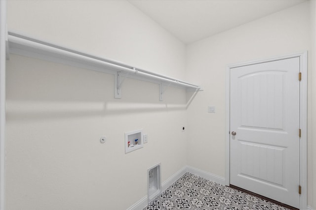 clothes washing area featuring electric dryer hookup, light tile patterned flooring, gas dryer hookup, and hookup for a washing machine