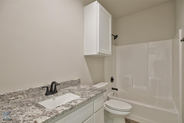 full bathroom featuring toilet, tub / shower combination, and vanity