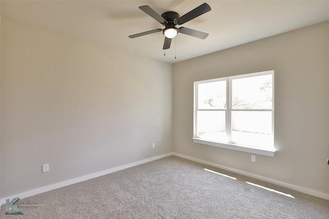 empty room featuring carpet flooring and ceiling fan