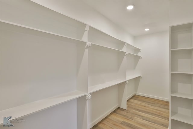 walk in closet featuring light wood-type flooring