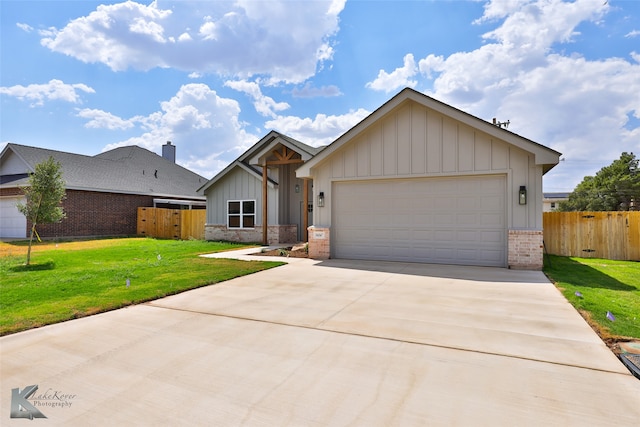 view of front of house with a garage and a front yard