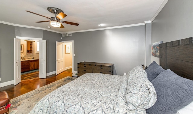 bedroom with visible vents, ornamental molding, a ceiling fan, wood finished floors, and baseboards