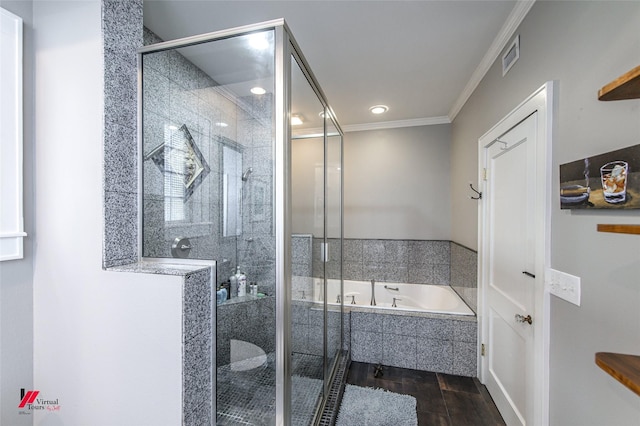 full bathroom featuring a garden tub, wood finished floors, visible vents, ornamental molding, and a shower stall