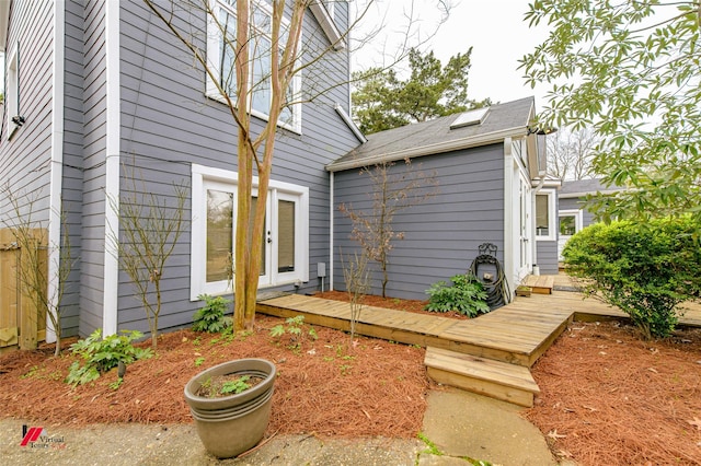 exterior space with french doors and a wooden deck