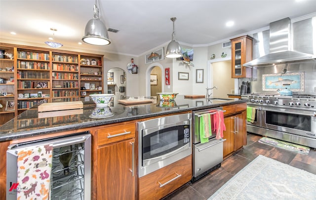 kitchen featuring brown cabinets, wall chimney range hood, wine cooler, and stainless steel appliances