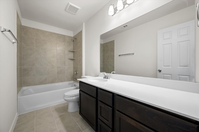 full bathroom featuring vanity, toilet, tile patterned floors, and tiled shower / bath