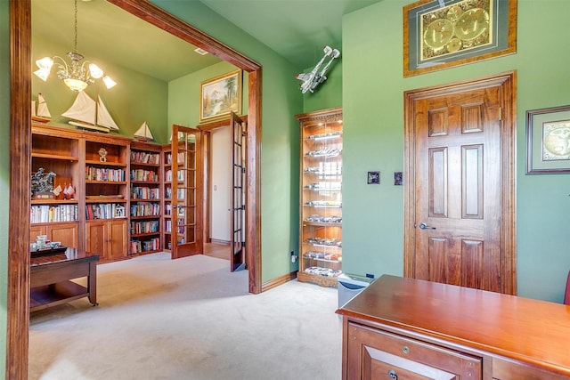 carpeted office featuring a chandelier and a high ceiling