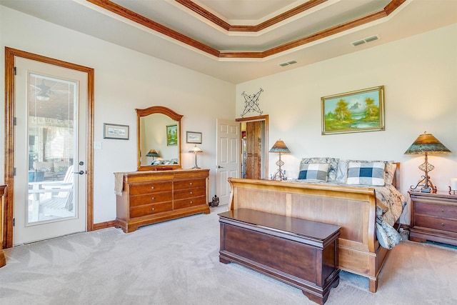 carpeted bedroom featuring ornamental molding, a raised ceiling, and access to outside