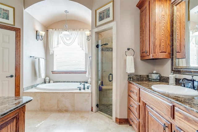 bathroom featuring vanity and plus walk in shower