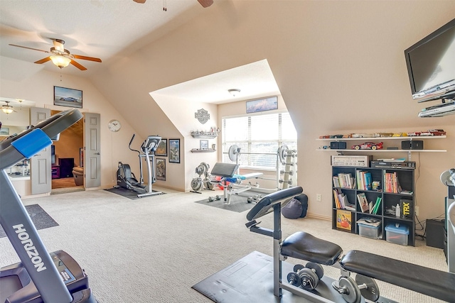 exercise area with ceiling fan, carpet flooring, and vaulted ceiling