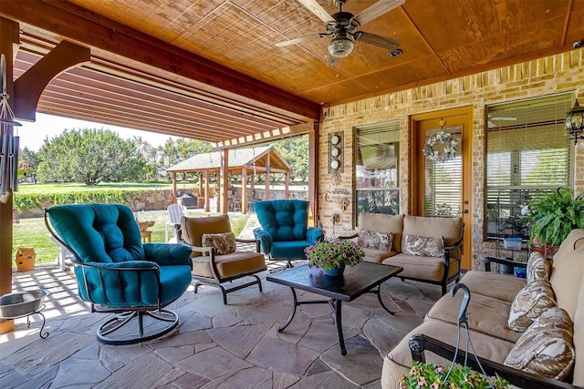 view of patio / terrace featuring an outdoor living space, a gazebo, and ceiling fan