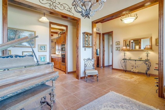 misc room featuring light tile patterned flooring and beam ceiling