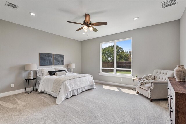 carpeted bedroom featuring ceiling fan