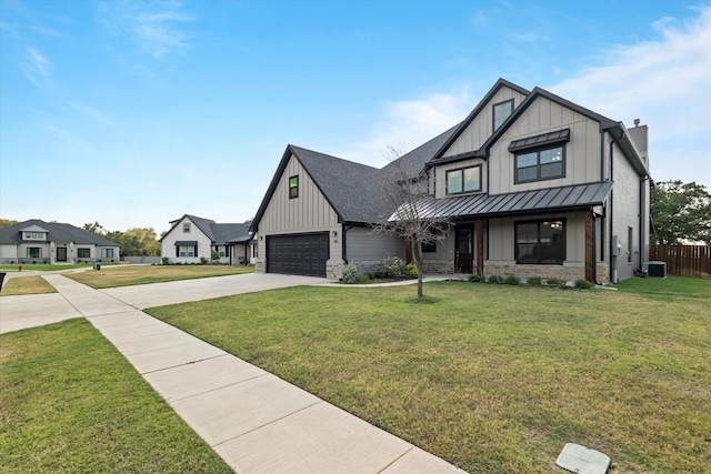 modern farmhouse style home with a garage, a front lawn, and central air condition unit