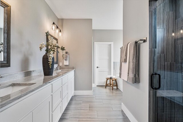 bathroom featuring vanity and walk in shower