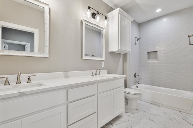 full bathroom with tiled shower / bath, vanity, toilet, and tile patterned flooring