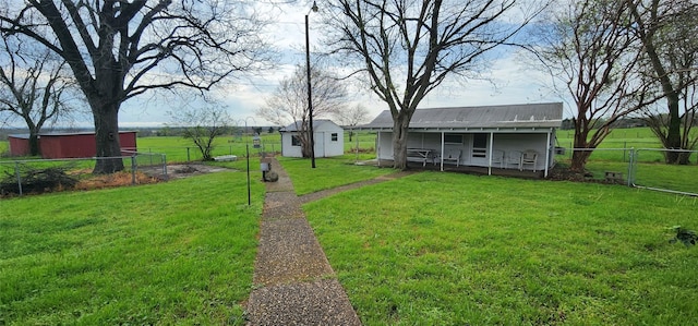 view of yard with a storage unit