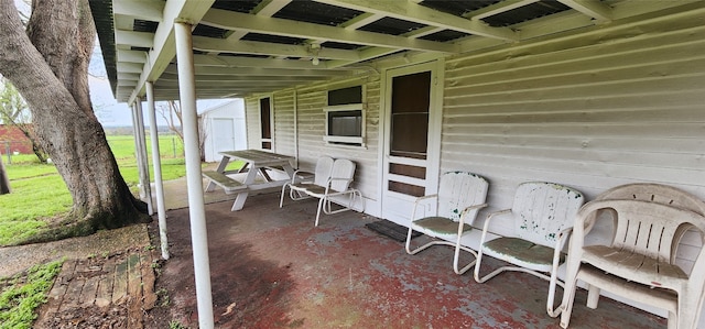 view of patio with a storage unit