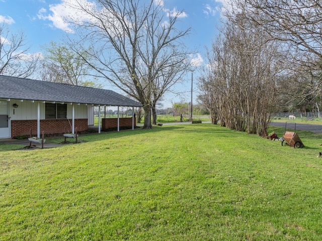 view of yard featuring a carport