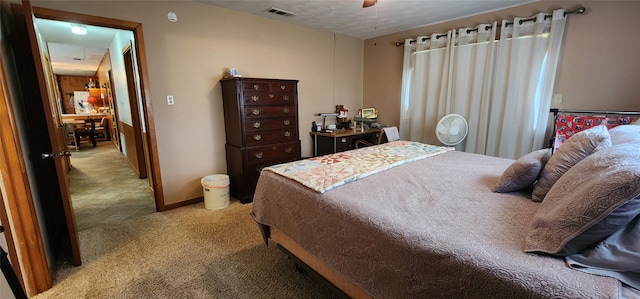 tiled bedroom with ceiling fan