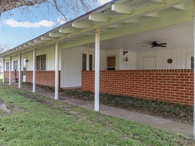 view of side of property featuring ceiling fan