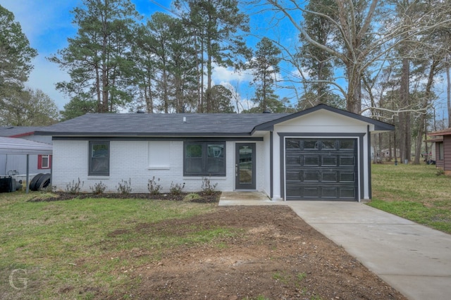 ranch-style house featuring a front yard and a garage