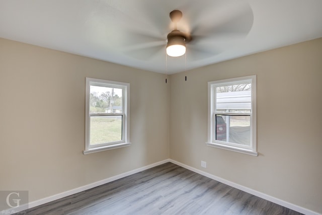 unfurnished room with light hardwood / wood-style flooring and ceiling fan