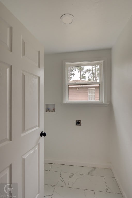 laundry room featuring hookup for a washing machine, hookup for an electric dryer, and light tile floors