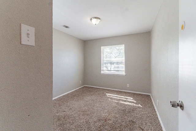 unfurnished room featuring carpet