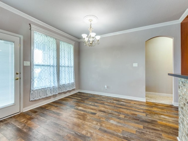 102 Apollo Trl, Aurora, TX 76078 - unfurnished dining area with hardwood / wood-style floors, arched walkways, a chandelier, ornamental molding, and baseboards