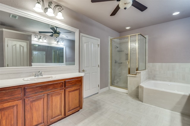 bathroom with shower with separate bathtub, ceiling fan, tile flooring, and vanity