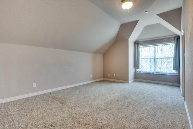 102 Apollo Trl, Aurora, TX 76078 - additional living space with carpet, vaulted ceiling, and baseboards