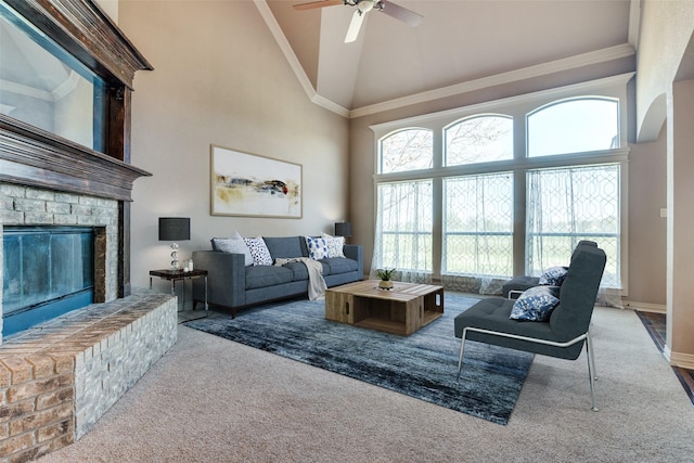102 Apollo Trl, Aurora, TX 76078 - carpeted living area with high vaulted ceiling, a ceiling fan, a fireplace, baseboards, and ornamental molding