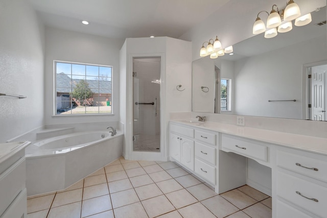 bathroom with tile patterned flooring, vanity, shower with separate bathtub, and a wealth of natural light