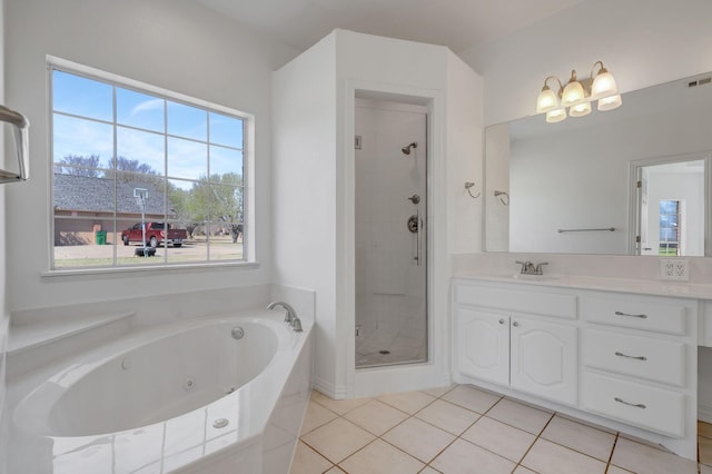 bathroom featuring tile patterned flooring, vanity, and independent shower and bath