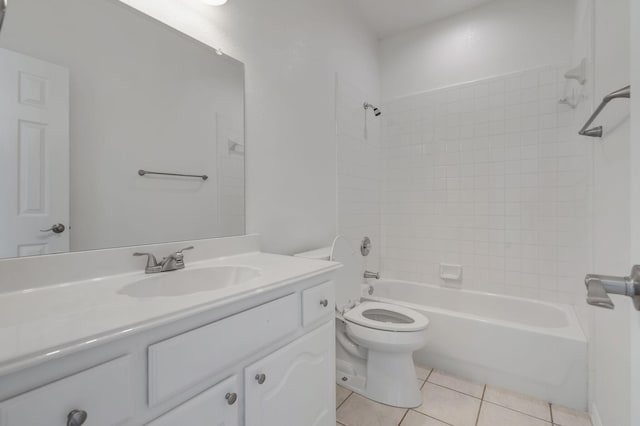 full bathroom with tile patterned flooring, vanity, toilet, and tiled shower / bath